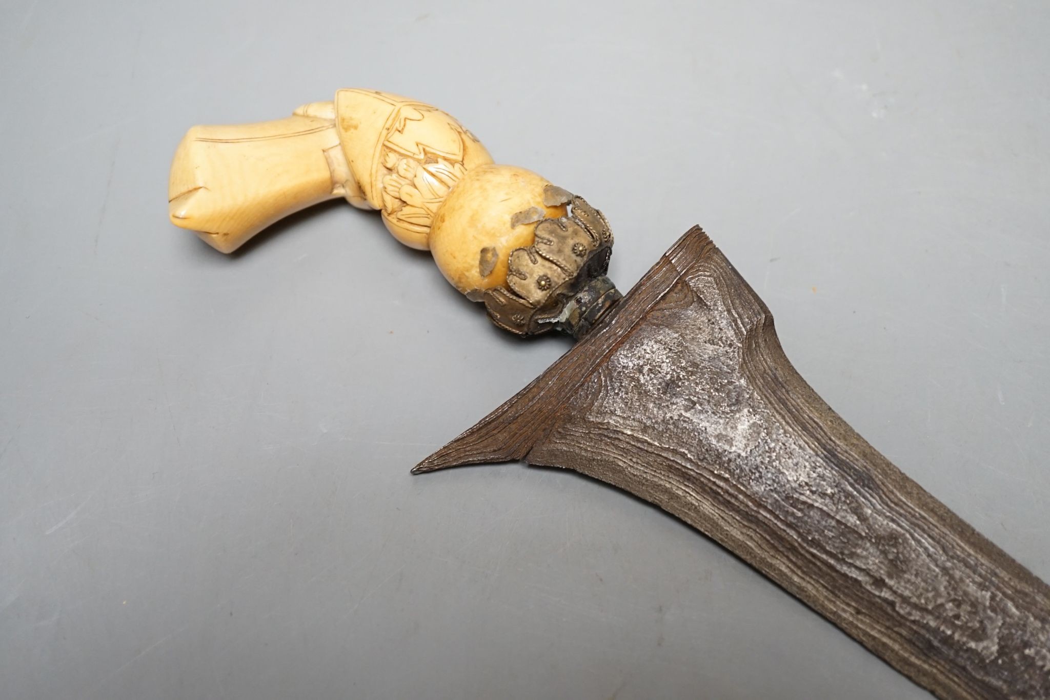 A 19th century ivory handled Kris, 40 cms long.